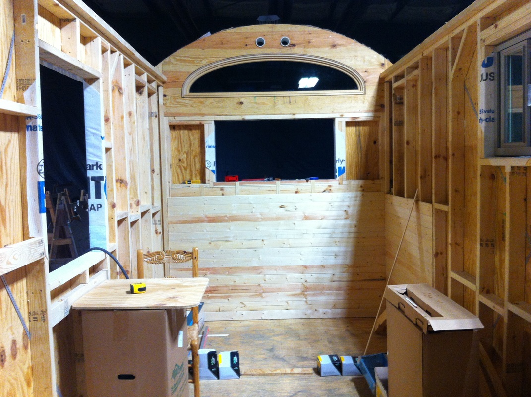 TURN ON IMAGES to see unfinished interior of tiny house with curved roof